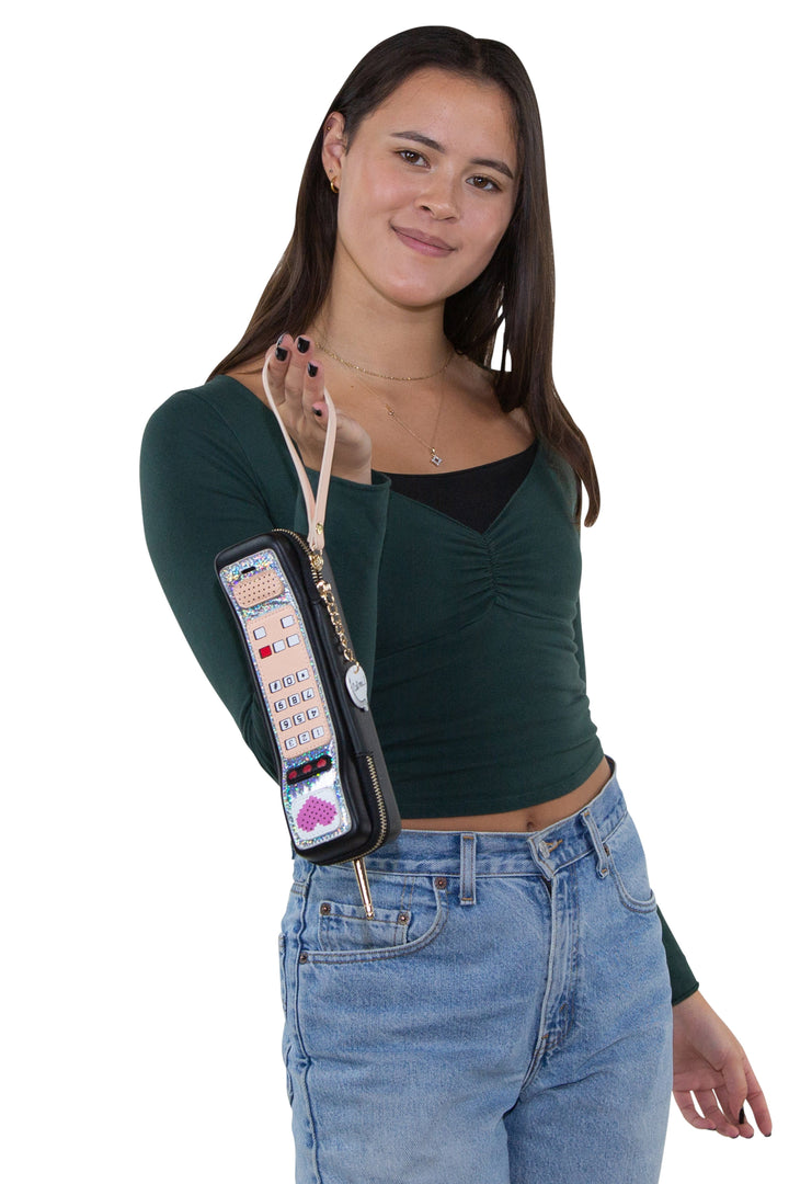 Sleepyville Critters - Handheld Vintage Phone Wristlet in Vinyl Material, handheld by model