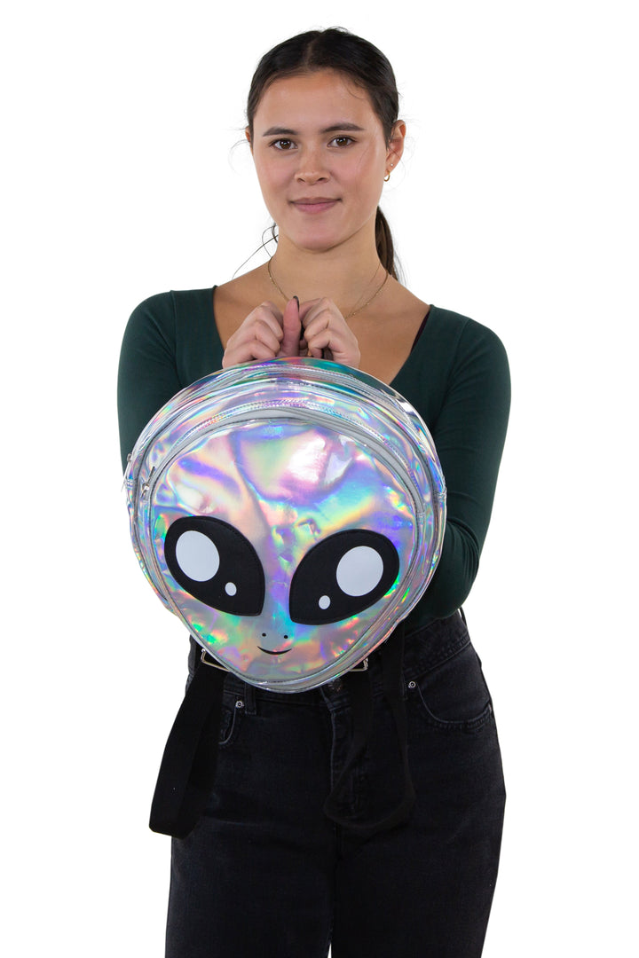 Green Alien Head Vinyl Backpack in Vinyl Material, silver color, front view, handheld by model