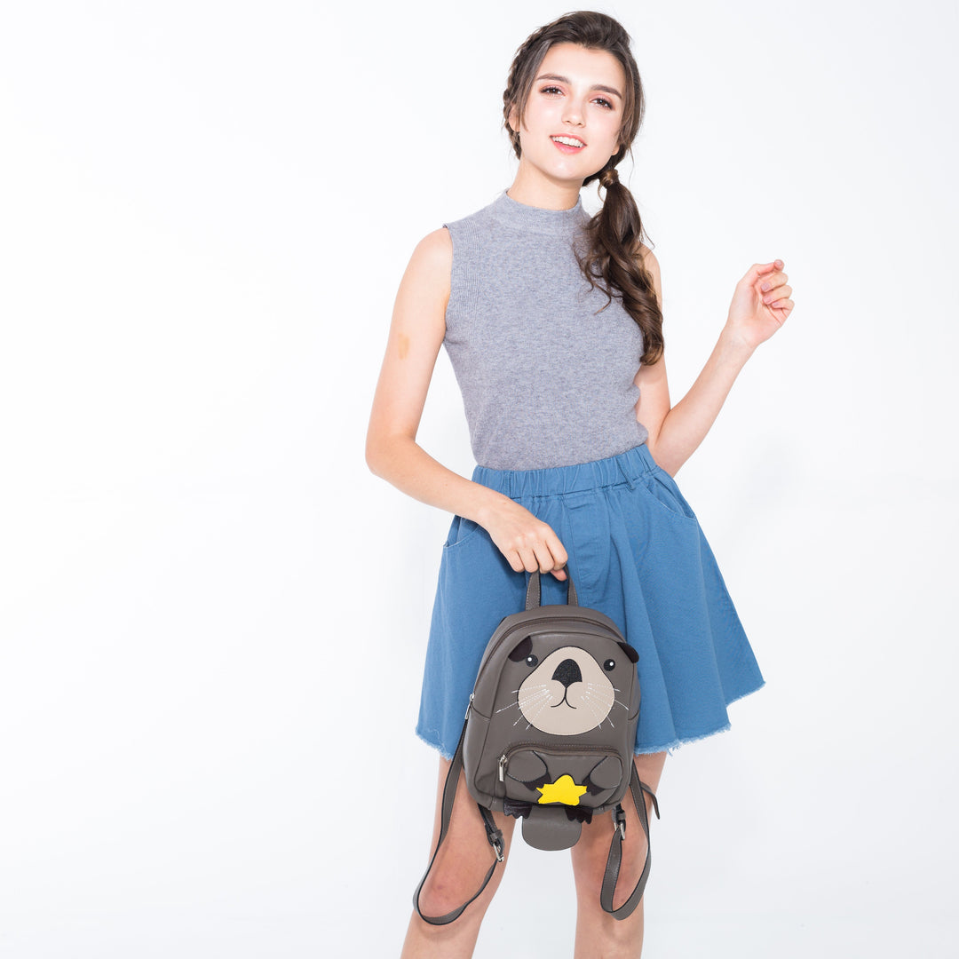 Mini Otter Backpack in Vinyl Material on model